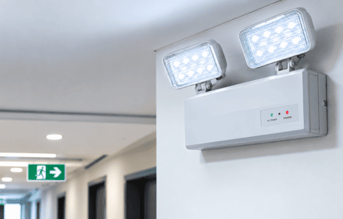 Emergency lighting and illuminated exit signs in a commercial building in UAE